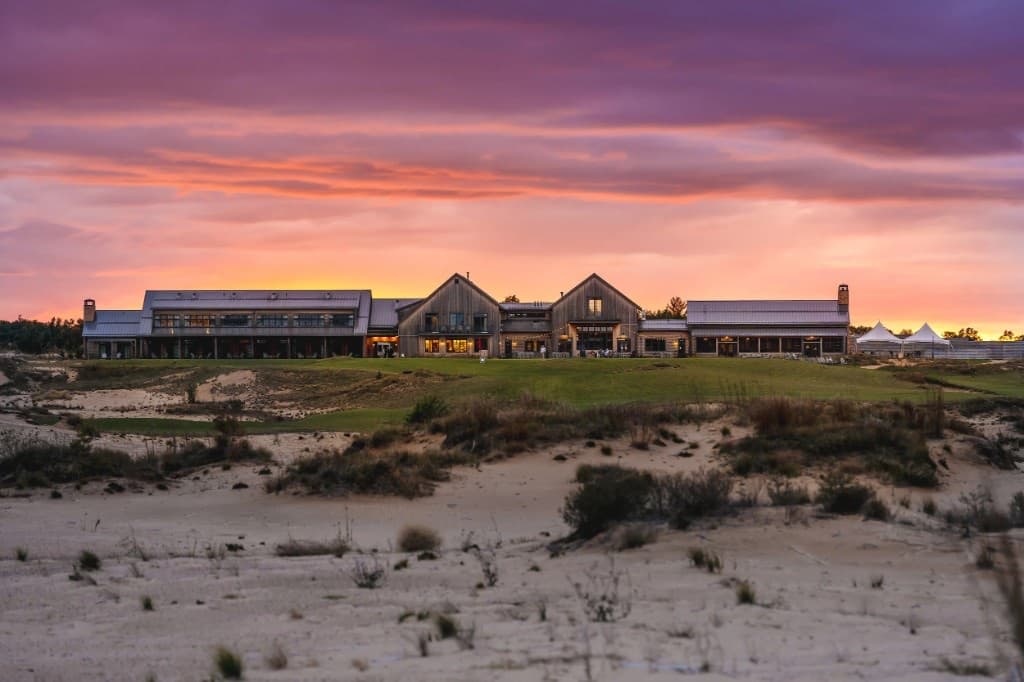 Sand Valley lodge above sand barrens at sunset